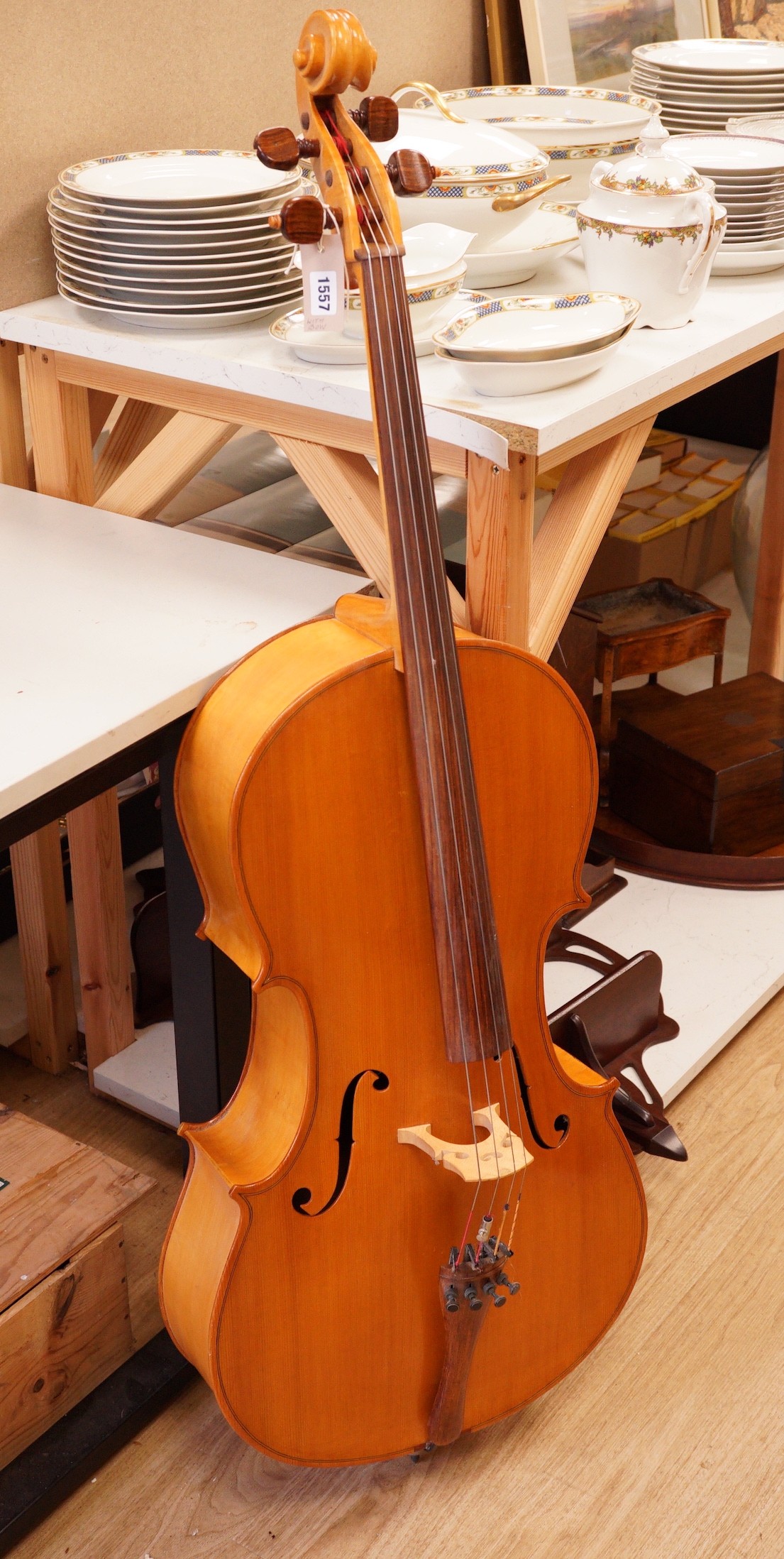 A cello and bow, back measures 73cm